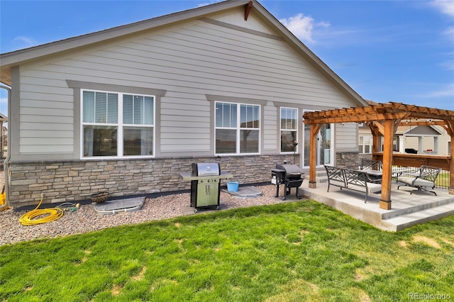 rear view of house featuring a lawn, a pergola, a patio, and stone siding