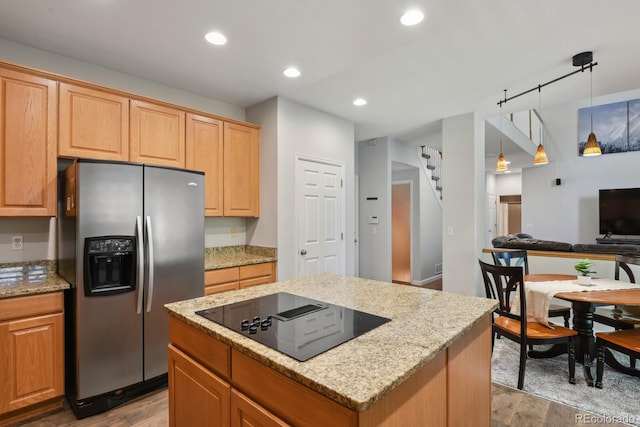 19653 E Ida Dr, Aurora, CO 80015 - kitchen featuring stainless steel refrigerator with ice dispenser, black electric cooktop, light wood-style flooring, light stone counters, and recessed lighting