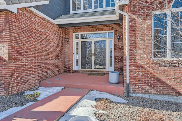 view of exterior entry featuring french doors