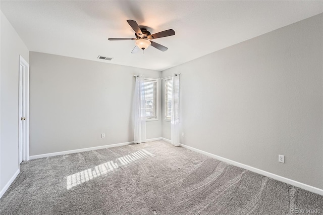 spare room featuring carpet floors and ceiling fan