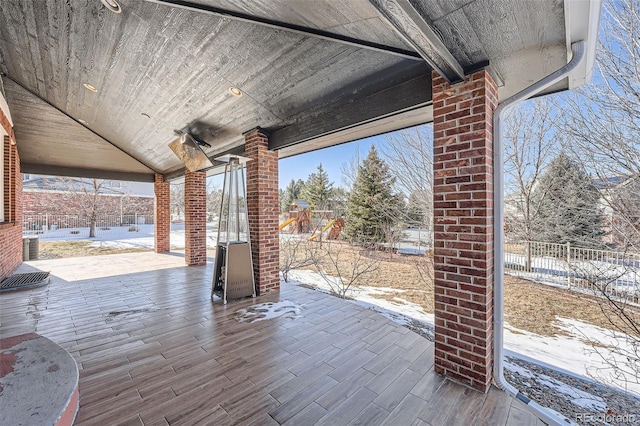 snow covered patio with fence