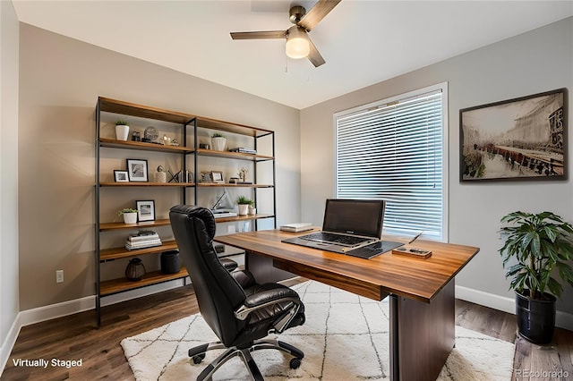 office area featuring wood finished floors, baseboards, and ceiling fan