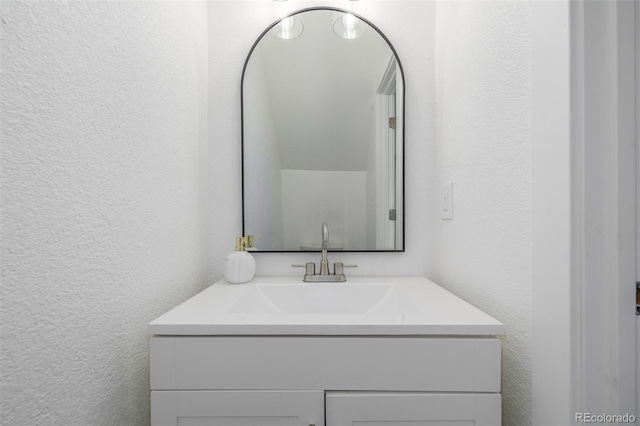 2232 Coronado Pkwy Unit B, Denver, CO 80229 - bathroom with a textured wall and vanity