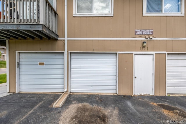 2232 Coronado Pkwy Unit B, Denver, CO 80229 - garage featuring driveway