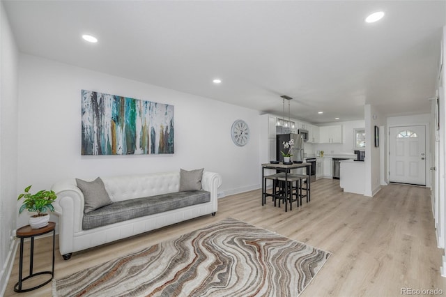 2232 Coronado Pkwy Unit B, Denver, CO 80229 - living area with light wood-style floors and recessed lighting