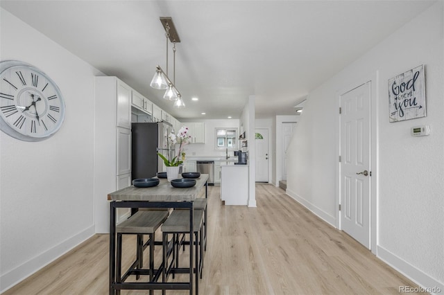 2232 Coronado Pkwy Unit B, Denver, CO 80229 - dining space featuring light wood-type flooring and recessed lighting