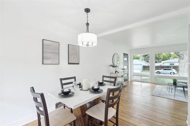 5445 Nebraska Way, Denver, CO 80246 - dining space featuring light wood-style flooring and beam ceiling