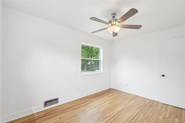 5445 Nebraska Way, Denver, CO 80246 - spare room with light wood-style flooring, baseboards, and a ceiling fan