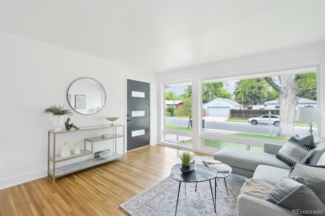 5445 Nebraska Way, Denver, CO 80246 - living area with healthy amount of natural light, wood finished floors, and baseboards
