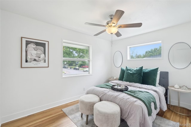 5445 Nebraska Way, Denver, CO 80246 - bedroom with wood finished floors, baseboards, and a ceiling fan