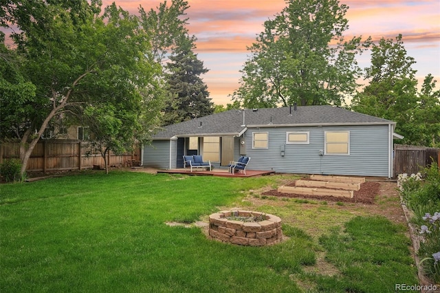 5445 Nebraska Way, Denver, CO 80246 - back of house with a fire pit, a wooden deck, and a shingled roof