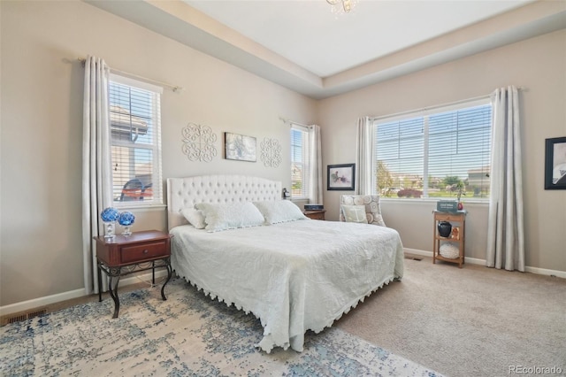bedroom with carpet and baseboards