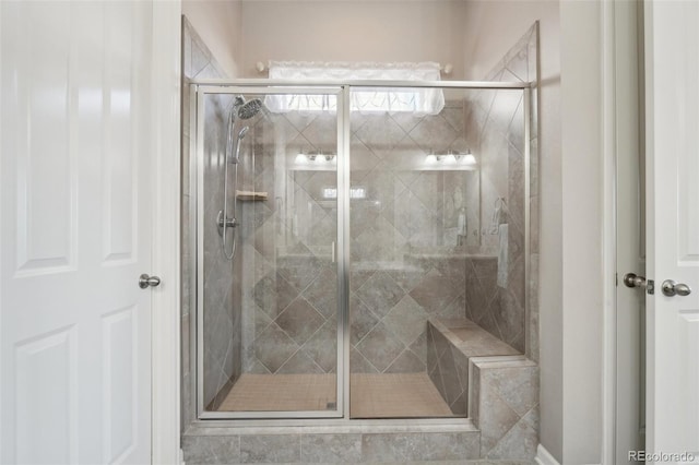 full bath with a shower stall