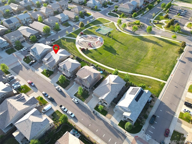 aerial view of property and surrounding area with nearby suburban area