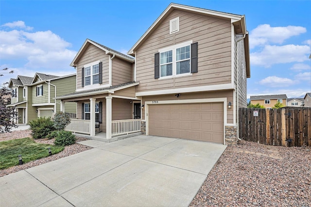 view of front of property with a garage and a porch