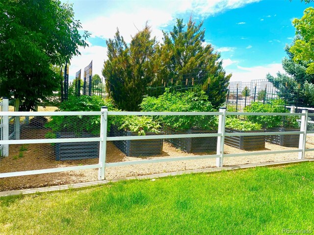 view of community with fence