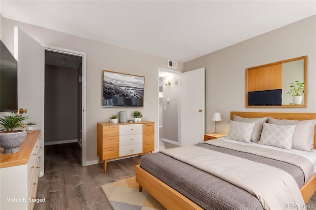 bedroom featuring dark hardwood / wood-style flooring