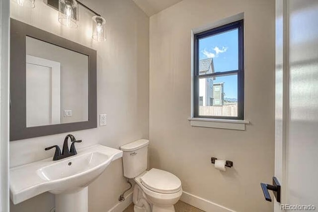 136 Chase St, Salida, CO 81201 - half bath featuring baseboards and toilet