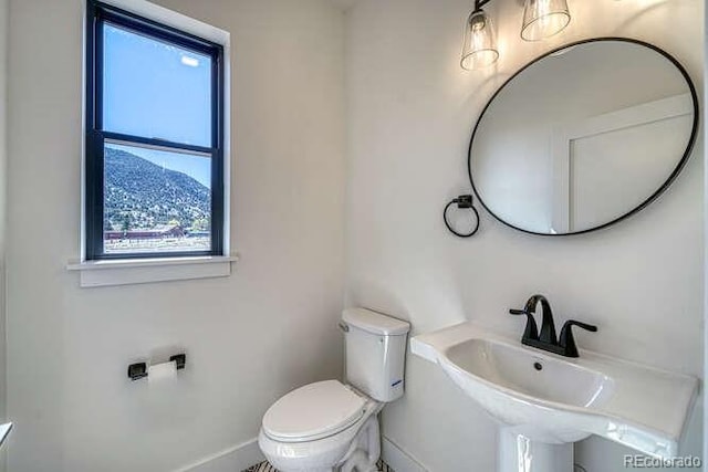 136 Chase St, Salida, CO 81201 - bathroom featuring toilet and baseboards