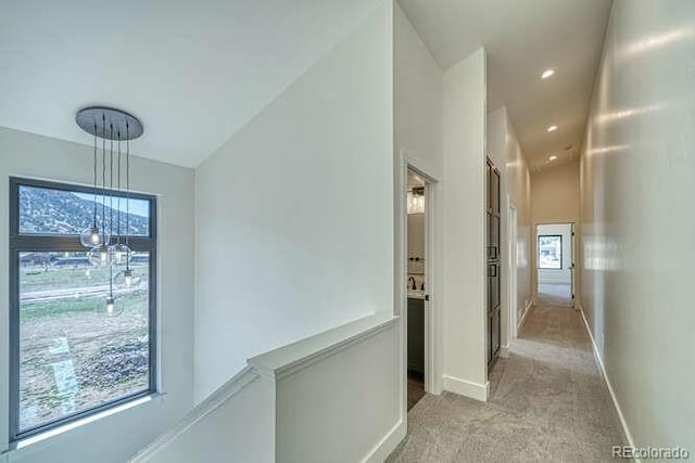 136 Chase St, Salida, CO 81201 - hallway with light colored carpet and vaulted ceiling