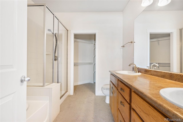 full bathroom featuring toilet, independent shower and bath, and vanity