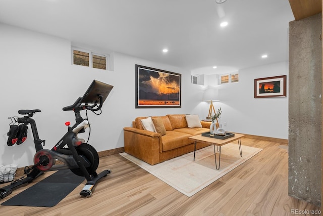 exercise area with wood finished floors, baseboards, and recessed lighting