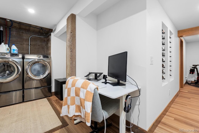 washroom with separate washer and dryer, wood finished floors, a desk, recessed lighting, and baseboards