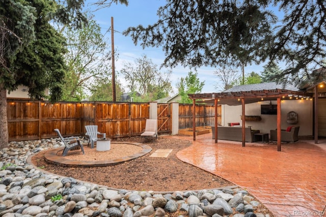fenced backyard featuring a patio area and an outdoor living space