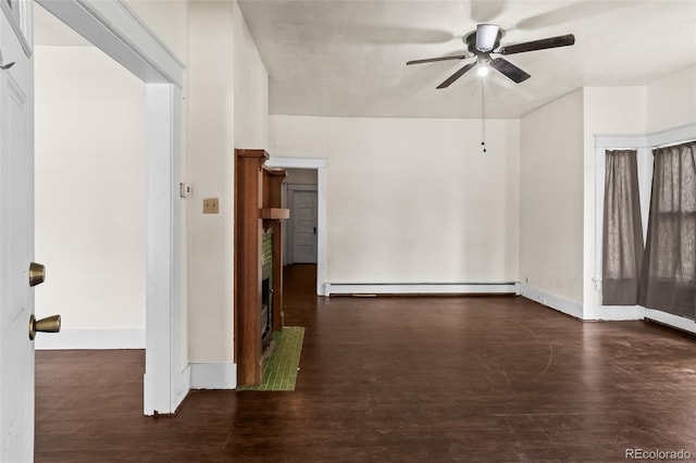 458 Cherry St, Hudson, CO 80642 - unfurnished room featuring a baseboard heating unit, a ceiling fan, and wood finished floors