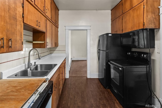 458 Cherry St, Hudson, CO 80642 - kitchen with black appliances, light countertops, dark wood-style flooring, backsplash, and brown cabinetry