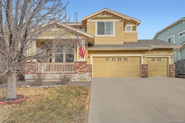 craftsman inspired home featuring a garage and a front yard