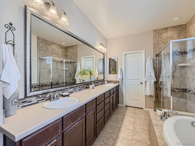 16658 Prospect Ln, Broomfield, CO 80023 - full bathroom featuring double vanity, a shower stall, a bath, and tile patterned floors