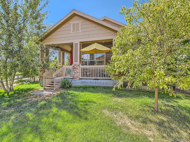 16658 Prospect Ln, Broomfield, CO 80023 - view of front of property with a front lawn and covered porch