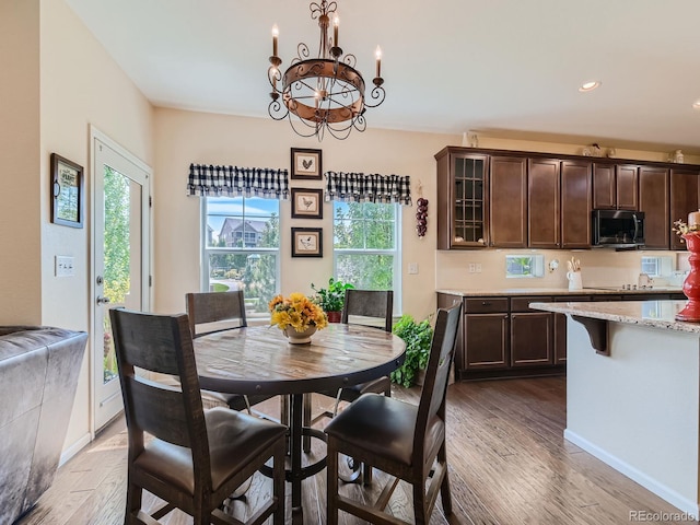 16658 Prospect Ln, Broomfield, CO 80023 - dining space featuring dark wood finished floors, a chandelier, and recessed lighting