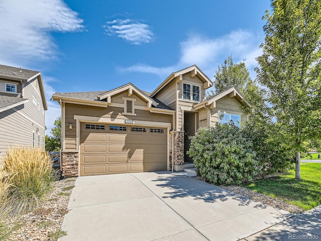 16658 Prospect Ln, Broomfield, CO 80023 - view of front facade featuring concrete driveway, a garage, and stone siding