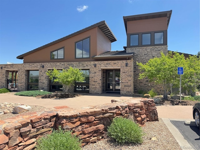 4391 Mcmurdo Ct, Castle Rock, CO 80108 - rear view of property with a patio and stone siding