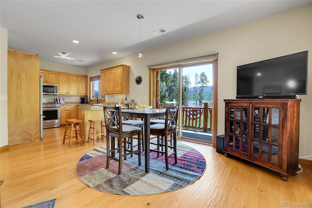 147 Forest Trl Unit 3, Winter Park, CO 80482 - dining room with light wood-type flooring and recessed lighting