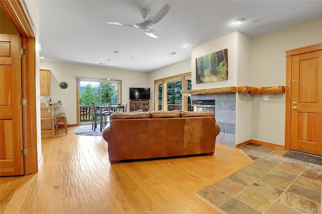 147 Forest Trl Unit 3, Winter Park, CO 80482 - living area with a ceiling fan, a tile fireplace, and recessed lighting