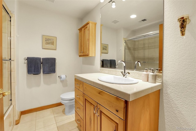 147 Forest Trl Unit 3, Winter Park, CO 80482 - bathroom featuring vanity, tile patterned floors, and combined bath / shower with glass door