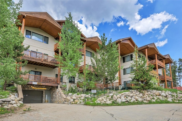 147 Forest Trl Unit 3, Winter Park, CO 80482 - view of apartment building / complex with an attached garage and driveway
