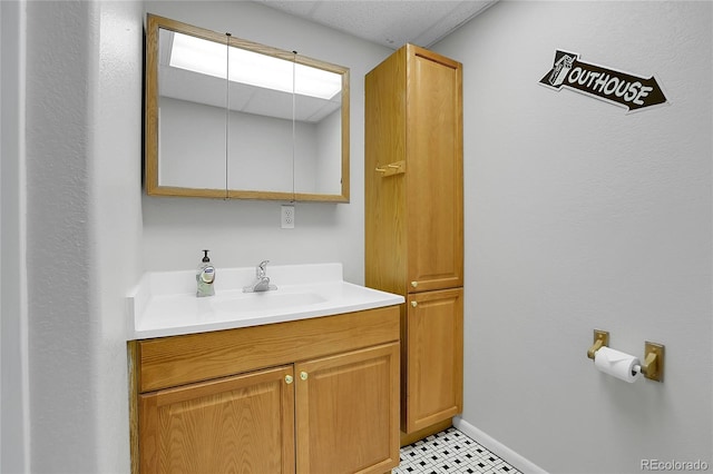 bathroom with oversized vanity and tile floors