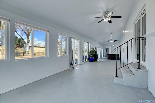 interior space featuring ceiling fan and lofted ceiling