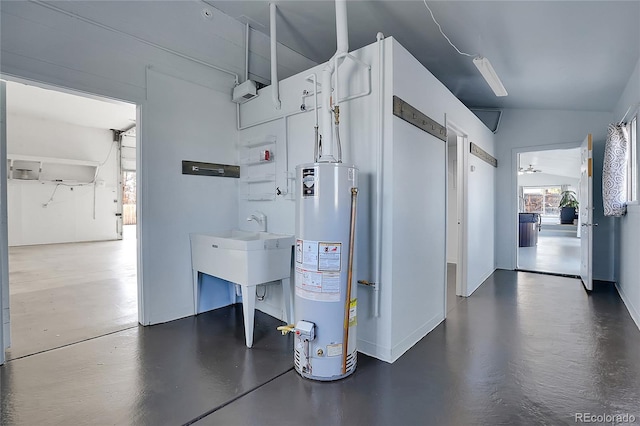 interior space with vaulted ceiling and water heater