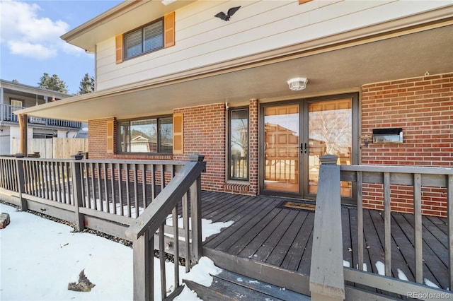 view of snow covered deck