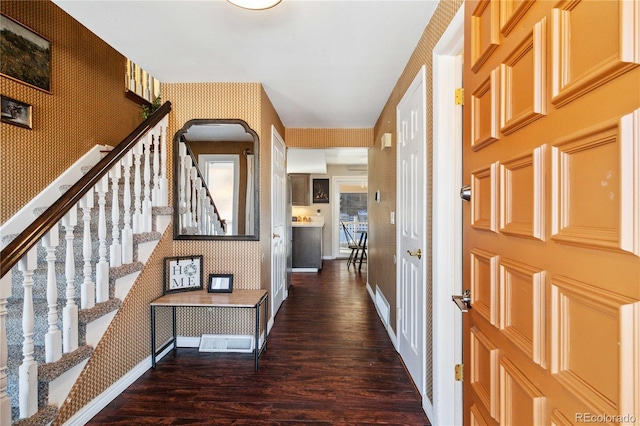 entrance foyer featuring dark hardwood / wood-style floors