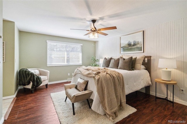 bedroom with ceiling fan and dark hardwood / wood-style floors