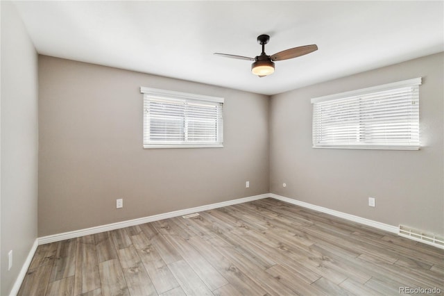 empty room featuring light hardwood / wood-style floors and ceiling fan