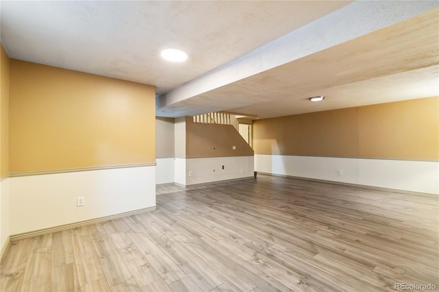 spare room featuring wood-type flooring