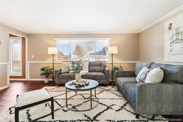 living room with wood-type flooring and ornamental molding