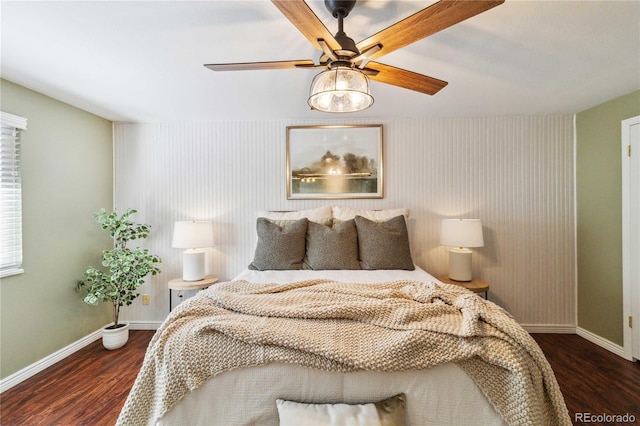 bedroom with dark wood-type flooring and ceiling fan